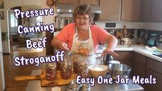 a woman in an apron preparing food on top of a kitchen counter with the words pressure canning beef stroganoff easy one star meals