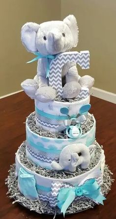 a diaper cake with an elephant on top