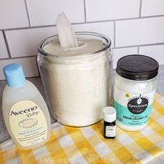 the ingredients to make homemade body scrubs sit on a yellow and white checkered tablecloth