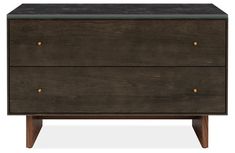 the chest of drawers is made out of wood and black marble