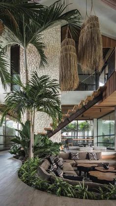 the inside of a building with plants and stairs