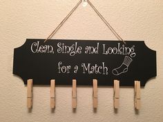 a sign hanging on the wall that says clean, single and looking for a match