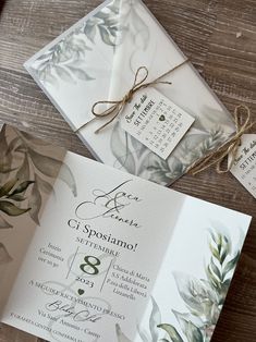 the wedding stationery is laid out and ready to be put into their guests'bags