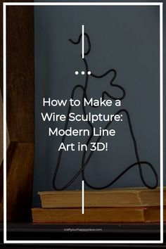 a wire sculpture sitting on top of a wooden table next to an open book with the words how to make a wire sculpture modern line art in 3d