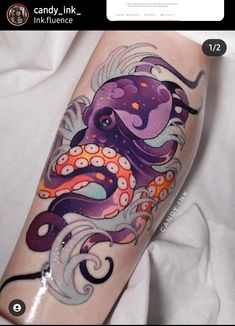 an octopus tattoo on the arm with watercolors and ink work done by person