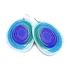 Constructed from hypoallergenic and lightweight metals, these large and brightly colored solid oval earrings have a bold personality while remaining gentle on your ears–perfect for those with metal sensitivities. The digitally painted design is contemporary and playful, making a bold statement.DETAILS:• 2 1/4" X 1 1/4"• Made with hypoallergenic metal for sensitive ears.• Aluminum earrings, nickel-free.• Titanium hooks, nickel-free.• Lightweight and tarnish-free metals.• Highly durable.• Soft rub Light Blue Earrings, Quilling Pattern, Aluminum Earrings, Hoop Dangle Earrings, Oval Earrings, Oval Earring, Send Gift, Large Earrings, Floral Earrings