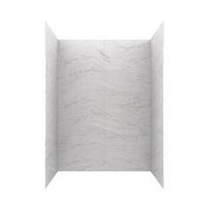 an empty shower stall with white marble walls