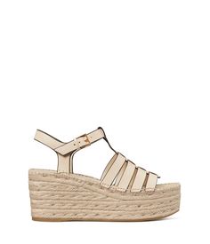 A fresh take on the classic fisherman silhouette, the Tory Burch® Fisherman Espadrille Wedge 75 mm will become your absolute favorite..Strappy bovine leather upper..Leather lining with a cushioned footbed..Adjustable buckle closure on the ankle strap..Open round toe silhouette..Strappy fisherman design with T-strap detail..Brand name detailing on the footbed..Rope-wrapped high wedge heel..Durable rubber outsole..Imported..Product measurements were taken using size 7, width M. Please note that me Classic Leather Espadrilles For Spring, Classic Closed Toe Wedge Sandals For Summer, Classic Spring Wedge Heel Sandals, Spring Natural Leather Wedge Sandals, Summer Leather Wedge Sandals With Reinforced Heel, Leather Wedge Sandals With Reinforced Heel For Summer, Natural Leather Platform Espadrilles, Natural Leather Wedge Heel Espadrilles, Classic Leather Wedge Sandals For Summer