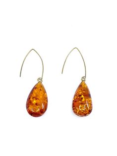 Spectacular Long Earrings made by Polish Designer Stone: Baltic Cognac Amber Sterling Silver Earrings SKU: AMER082823-02 Dimensions: Stones are approx. 1.25" long x .75" wide x 2" depth Length: Hang approx. 2.5" long Material: Gold Plated Silver Hooks Brown Long Drop Earrings For Gift, Brown Teardrop Earrings For Formal Occasions, Formal Brown Teardrop Earrings, Orange Teardrop Earrings For Formal Occasions, Formal Orange Teardrop Earrings, Statment Earrings, Silver Statement Earrings, Stone Design, Gold Plated Silver