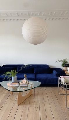 a living room filled with furniture and a blue couch