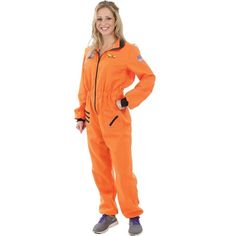 a woman in an orange jumpsuit posing for the camera with her hands on her hips