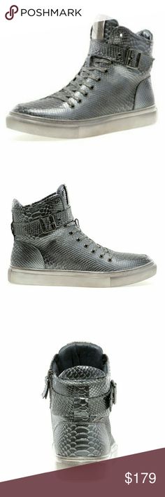 JUMP NEW YORK SULLIVAN PEWTER SNEAKER Material: Leather Upper  Sole: Rubber  Hand Painted Leather Padded Collar & Tongue Strap & Buckle Detail Padded Sock Lining Non-Skid Outsole Shaft Height (est.) : 5? Circumference (est.) : 12? Hook & Loop Closure Adjustable-Strap True To Size Jump Shoes Sneakers Silver High-top Boots For Winter, Silver Leather Winter Boots, Metallic Silver Leather Boots With Round Toe, Hand Painted Leather, Painting Leather, Golden Goose Sneaker, Adjustable Straps, Leather Upper, Shoes Sneakers