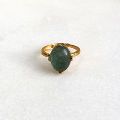 A stunning and large 13mm all natural green-blue moss aquamarine with a very high dome is prong set into a 22k gold over sterling vermeil setting. This stone absolutely glows from every single angle. The size is fully adjustable on the very comfortable band. An absolute one and only fine gemstone ring. Gold Emerald Ring With Natural Stones For Anniversary, Gold Oval Emerald Ring For Everyday Wear, Gold Emerald Ring With Large Oval Stone, Elegant Gold Emerald Ring With Natural Stones, Gold Emerald Cabochon Ring For May Birthstone, Gold Emerald Ring With Spiritual Style, Spiritual Gold Emerald Ring With Gemstone, 14k Gold Green Gemstone Dome Ring, Spiritual Gold Emerald Ring