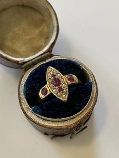 Antique marquise shaped seed pearl and natural ruby ring. The ring has 18ct marked inside but rubbed. The ring can be sized but is a size 5 at the moment. Natural Ruby Ring, Historical Dress, Marquise Ring, White Gold Bracelet, Seed Pearl, Multi Stone Ring, Ruby Ring, Natural Ruby, Gold Engagement Rings