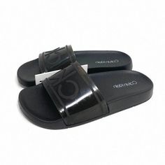 Brand New With Tag No Box. 100% Authentic. Same Or Next Day Shipping Msrp: $45.00 Save Now! The More You Bundle - The Better Offer You Get! Ready For The Pool And The Sand, These Slide Sandals Are Designed With A Bold, Signature Look. Detailed With A Ck Logo Crossover Strap, A Contoured Footbed For Premium Comfort And Logo Detailing On The Sole. Product Details Austin Logo Slide Sandal Ck Logo On Crossover Strap Contoured Footbed Ck Logo On Footbed + Sole Synthetic Imported Calvin Klein Black Sandals For Summer, Calvin Klein Black Open Toe Sandals, Calvin Klein Black Leather Sandals, Black Leather Calvin Klein Sandals, Ck Logo, Grey Sandals, Nike Air Max Tn, Calvin Klein Shoes, Calvin Klein Men