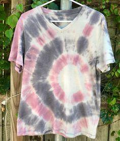 Aside from Lavender Bullseye being a great name for a band, it's also the name of this one-of-a-kind tie-dye t-shirt. This striking garment stands out with shades lavender and differing shades of purple juxtaposed with slate gray and shades of black. Size: L Manufacturer: Public Opinion Matrix: FTIDS1 This garment, like all from FlyTillIDye, is hand-crafted with love by our in-house designer. We proudly personally create these upcycled shirts, dresses, etc. We encourage further altering of any o Upcycle Shirt, Great Names, Public Opinion, Slate Gray, Tie Dye T Shirts, Shades Of Black, Shades Of Purple, Matrix