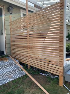 a wooden slatted screen on the side of a house