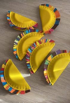 paper plate crafts are arranged on the table