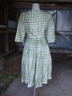 "This is a silky green and white print full skirt dress from the late 1950's or early 1960's. It features a wide neckline, below elbow length sleeves and full skirt pleated into the waist. Opens down the back with a well working zipper. In great shape. Comes from a smoke free home. Measurements: Bust: 35\" Waist: 25\" Hip: Full Bodice Depth: 15.5\" Waist to Hem: 27\" Length: 43\" Please ask me any questions you may have before buying as this is a final sale. Please know your measurements and all 50s Outfits, White High Heels, Full Skirt Dress, Kinds Of Clothes, Elbow Length Sleeve, Full Skirt, Vintage 1950s, Pleated Skirt, Bodice