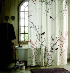 a bath room with a toilet and a shower curtain