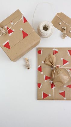 wrapping supplies are laid out on a white surface, including twine and paper bags