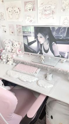 a white desk topped with a computer monitor and keyboard