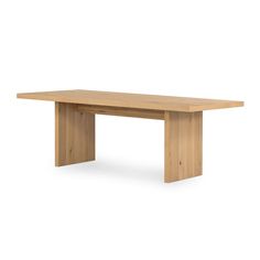 a wooden table sitting on top of a white floor