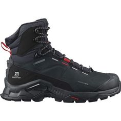 a pair of black hiking boots on a white background