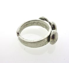 Ring made of pewter with a width of 8 mm The markings on these rings differ: One has 'B.L. tin' or 'pewter' while another ring has the marking 'pewter of Denmark'. Bent Larsen is a famous Danish jewelry designer, born in Assens, Denmark. He started making pewter (hardened tin) jewelry in his workplace in Husby in the late 1960s. His work is very recognizable by the beautiful stones and glass cabochons in bright colors. Many of his jewelry are marked with Bent Larsen Design and Made in Denmark or Adjustable Metal Engraved Ring, Vintage Adjustable Metal Rings, Adjustable Open Metal Engraved Ring, Vintage Adjustable Engraved Nickel-free Ring, Adjustable Vintage Engraved Nickel-free Ring, Vintage Adjustable Nickel-free Engraved Ring, Antique Adjustable Nickel-free Rings, Adjustable Nickel-free Vintage Engraved Ring, Adjustable Metal Engraved Open Ring