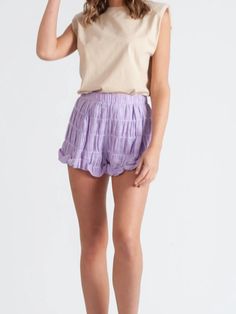 Wisteria Lilac Ruffle Shorts | Sassy Shortcake Lavender Short Bottoms For Spring, Short Lavender Bottoms For Spring, Lavender Short Length Bottoms For Spring, Casual Purple Tiered Skirt, Lavender Bottoms With Elastic Waistband For Spring, Summer Lavender Bottoms With Ruffles, Summer Lavender Ruffled Bottoms, Purple Elastic Waistband Shorts For Summer, Purple Shorts With Elastic Waistband For Summer