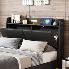 there is a bed that has been made with black leather headboard and foot board