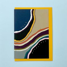 an abstract painting on a blue wall with yellow frame