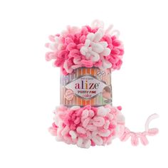 a pink and white ball of yarn sitting on top of a white surface with the word alize written in it