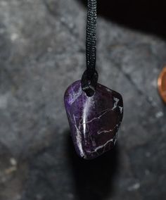 Sugilite Pendant with cord 27.8 carats 23 X 16 X 9 mm Chord included This item ships in a gift box ready for gifting or just keep for your own enjoyment. Metaphysical Gemstone Properties Sugilite Sugilite may assist one in remembering the reasons for being in the physical body, for living in this chosen physical destiny. Sugilite helps one in the understanding of negative circumstance by showing one what is happening, and how the experience is out of balance, as well as allowing the energy to br Purple Adjustable Cord Jewelry As Gift, Purple Jewelry With Adjustable Cord As Gift, Purple Jewelry With Adjustable Cord For Gift, Meteorite Necklace, Gemstone Properties, What Is Happening, Healing Stones, Crystal Pendant, Destiny