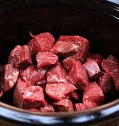 raw meat in a crock pot ready to be cooked