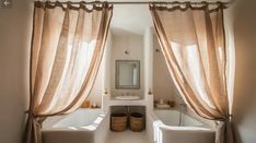 a bathroom with two white bath tubs sitting next to each other