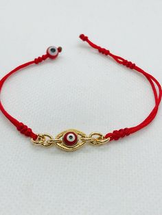 "Pulsera hecha a mano con el ojo rojo para la proteccion en oro chapeado terminado con hilo rojo reforzado delgado. hecha exclusiva para mujer. pulsera ajustable y expandible con cierre de candado minimo de 6.5\" pulgadas y maximo de 7\" pulgadas Aviso : si no es de su medida la pulsera; contactenos antes de comprar porque podemos hacer la medida que desea material: hilo rojo reforzado #A bola del mal ojo rojo 6mm cadena y del mal ojo en oro chapeado" Gold Resizable Evil Eye Spiritual Bracelet, Gold Resizable Spiritual Evil Eye Bracelet, Resizable Gold Spiritual Evil Eye Bracelet, Adjustable Evil Eye Gold Plated Bracelets, Adjustable Gold Plated Evil Eye Bracelets, Gold Evil Eye Bracelets, Handmade Red Metal Bracelets, Red Evil Eye Bracelets For Good Luck, Adjustable Gold Eye-shaped Jewelry