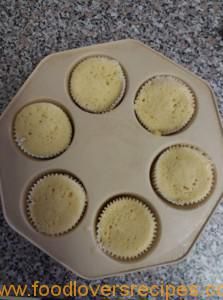 six cupcakes in a muffin pan ready to go into the oven