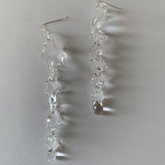 Welcome to Hidden Glass Atelier! Glad you have found me  ✦ DESIGN    ✧ Simple and elegant spiral dangling earrings with waves like deco, handmade with clear transparent Murano glass. The ear studs are made of sterling silver.    ✧ Styling: It is easy to wear up or down with a casual outfit or for a special occasion.  You could find a similar design ring set here :) https://hiddenglassatelier.etsy.com/listing/1554468897    ✧ Durability: All the glass jewelry pieces are tempered by a professional Murano Glass Earrings, Murano Glass Jewelry, Unique Jewelry Designs, Dangling Earrings, Unusual Gifts, Glass Earrings, Ear Studs, Glass Jewelry, Silver Studs