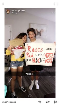 two people standing next to each other holding a sign that says roscs are red vans go to hoo mats