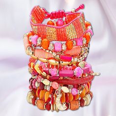 Part Of Our New Signature Stack Collection Of Artisan Beaded Stretch Boho Bracelet Sets. This Super-Sized Set Features Shades Of Coral, Pink, Magenta, Gold, Amber & Orange. Picture Witnessing A Stunning Sunset Seemingly Rising From The Sands Of The Sahara. There Are 14 Gorgeous Beaded Stretch Bracelets And 1 Seed Beaded Pull-To-Fit Tassel Back Bracelet For A Total Of 15 Pcs. The Gold-Dipped Charms Include Feathers, Cactus, Crescent Moon & Geometric Shapes. All Items From Our Own Artisan Line Of Pink Bohemian Bracelets For Party, Trendy Pink Friendship Bracelets For Festival, Bohemian Pink Hand Wrapped Friendship Bracelets, Pink Round Beads Friendship Bracelets For Festival, Adjustable Pink Bohemian Bracelet, Pink Friendship Bracelets With Colorful Beads For Festival, Bohemian Red Beaded Bracelets For Vacation, Bohemian Pink Adjustable Bracelets, Pink Hand Wrapped Friendship Bracelets For Festivals