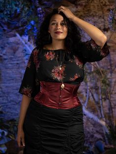 Model wearing the cs 301 waspie corset in wine colored silky satin.  Corset is worn over a dark floral blouse and black ruched cotton skirt. Plus Size Underbust Corset Outfits, Undergarment Corset, Underbust Corset Outfit, Best Waist Trainer Corset, Waspie Corset, Orchard Corset, Plus Size Satin, Corset Outfits, Best Waist Trainer