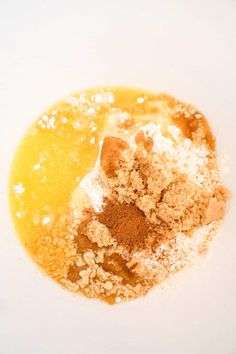 a white plate topped with powdered sugar and orange juice