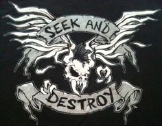 the back of a black shirt that says seek and destroy