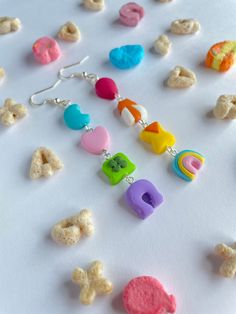 Lucky Charm earrings handmade out of polymer clay. Earrings are about 2.5 inches long. Lucky Charms Earrings, Polymer Clay Lucky Charms, Lucky Charm Earrings, Diy Earrings Clay, Cereal Earrings, Easy Clay Earrings, Clay Charm Ideas, Silly Earrings, Crazy Earrings