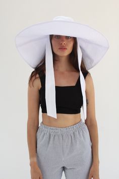 100% Cotton massive oversized floppy sunhat, full shade for face and shoulders, one size fits most, self tie sash for windy weather, or just some extra coverage. Travels and washable. Ultra sun protection. Made from Japanese woven textured cotton. This season the fabric has a textured, last seasons it had no texture. We looooove this hat. So good! Made in California. White Wide Brim Bucket Hat For Beach, Casual Beach Bonnet One Size, Casual One-size Beach Bonnet, White Curved Brim Bucket Hat For Vacation, White Wide Brim Bucket Hat For Summer, White Brimmed Sun Hat With Uv Protection, White One Size Bucket Hat For The Beach, White Bucket Hat With Uv Protection For Spring, White One Size Bucket Hat For Vacation