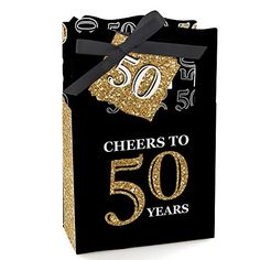 a black and gold 50th gift bag with the number 50 on it's side