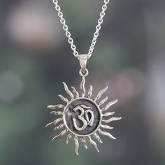 Let the radiant and sacred energy of the Om sound fill your soul with the universe's energies. Designer Ajay Patil and a talented Indian team honor the ancient doctrines that define their lives with this sterling silver pendant necklace featuring the sun with the Om symbol engraved in a combination of polished and oxidized finishes. Om Symbol, Sterling Silver Necklace Pendants, Silver Spring, Jewelry Packaging, Silver Pendant Necklace, Jewelry Gift Box, Free Jewelry, Spring Rings, Sterling Silver Pendants