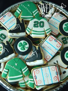 decorated cookies in the shape of hockeys and jerseys on a platter with text overlay