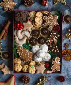 a box filled with lots of different types of cookies and pastries on top of a table